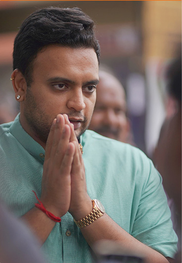 Man greeting with folded hands